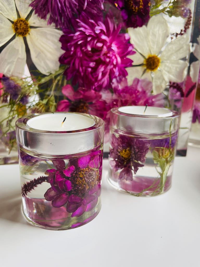purple and white wedding flowers preserved in resin tea light candle holders